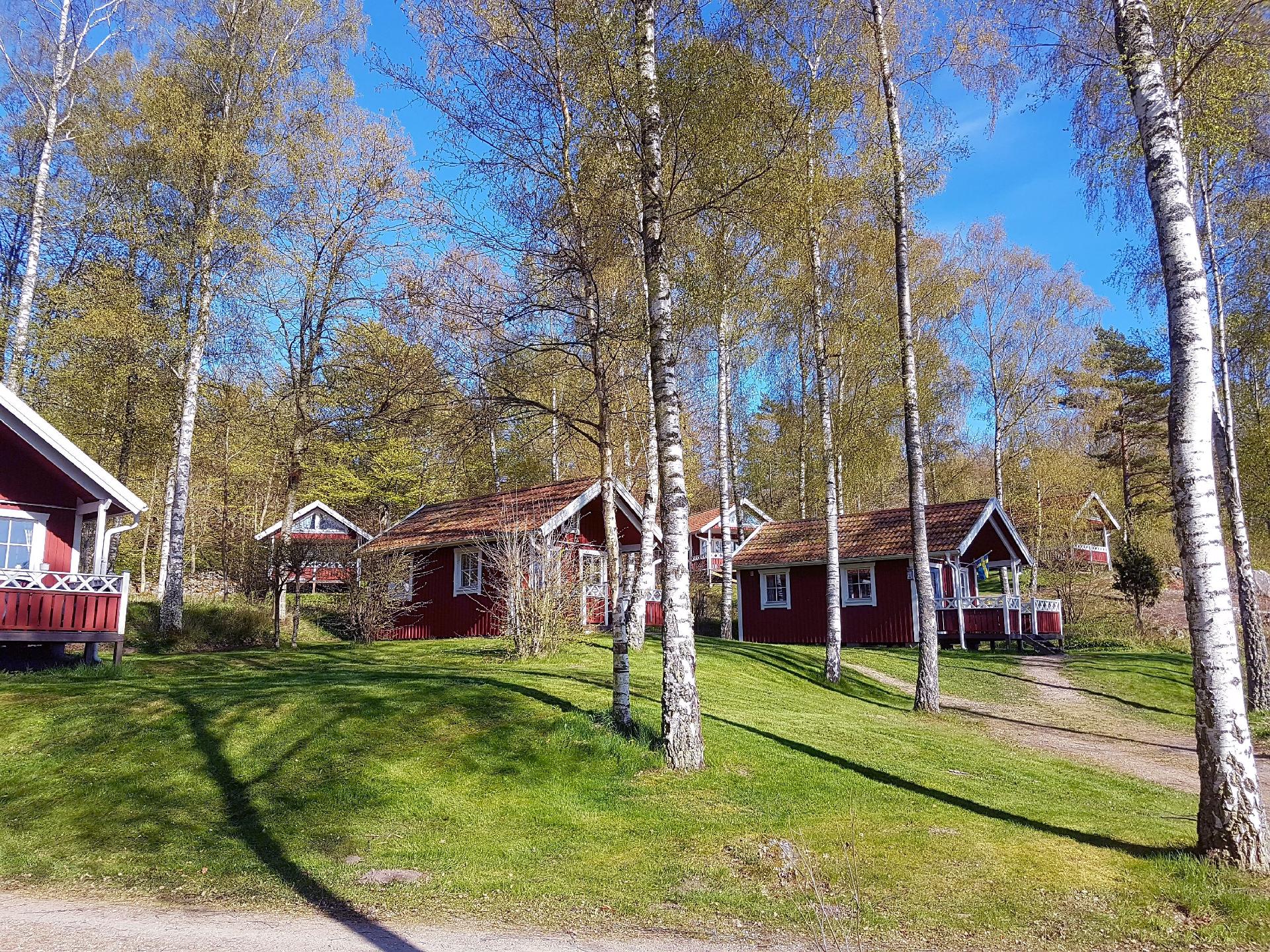 Holzhaus mit überdachter Terrasse Ferienhaus in Schweden